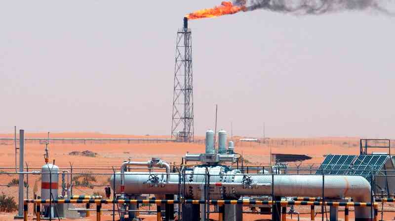 Saudi Aramco profits dip as oil output falls